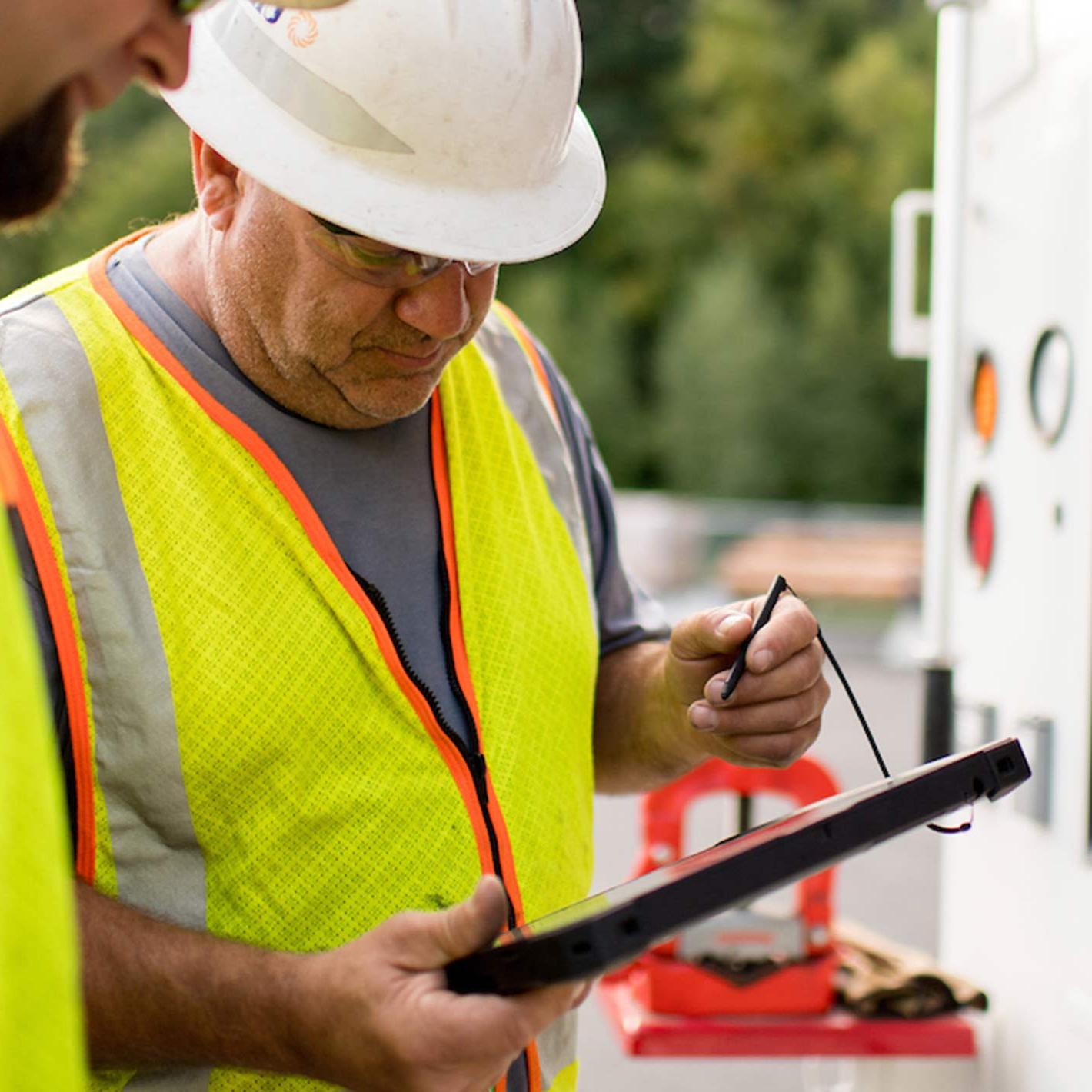 Unitil gas workers reviewing work orders